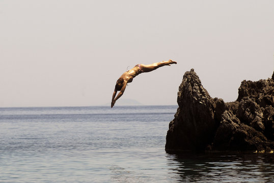 dennis bee add naked cliff jumping photo